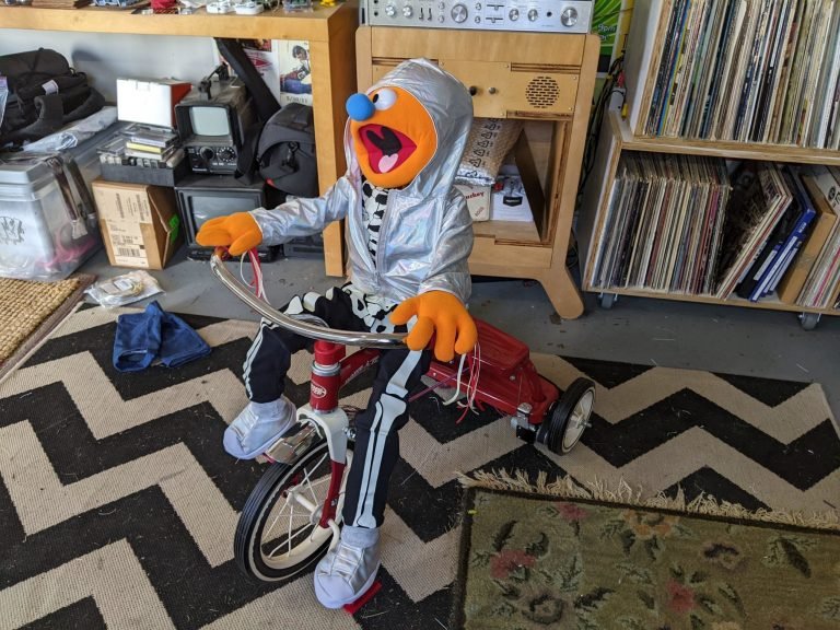 Making a puppet ride an RC tricycle