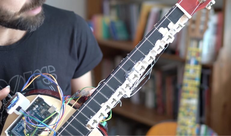 This mod tunes the guitar so you don’t have to